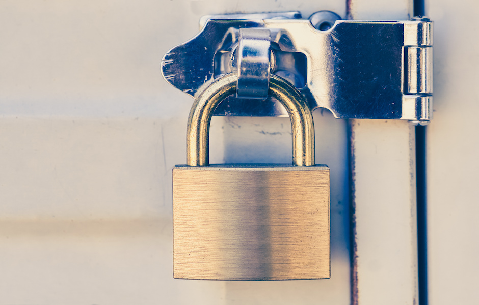 Close – up Metal padlock and metal white door Eviction Legal Services